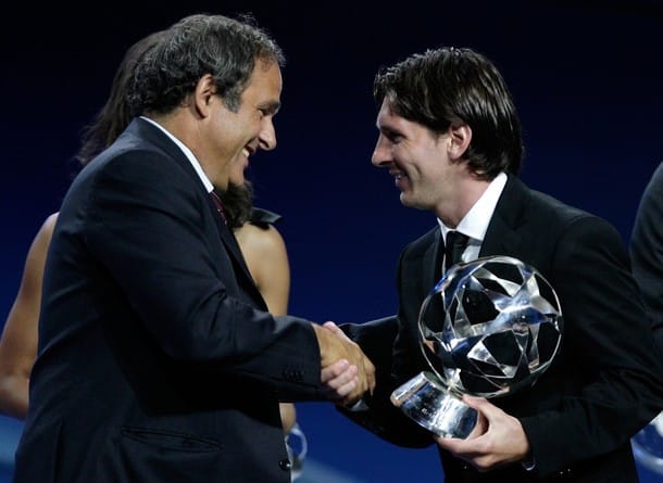 FC Barcelona's Lionel Messi receives the UEFA Club Footballer of the Year award from UEFA president Michel Platini at Monaco's Grimaldi Forum in Monte-Carlo